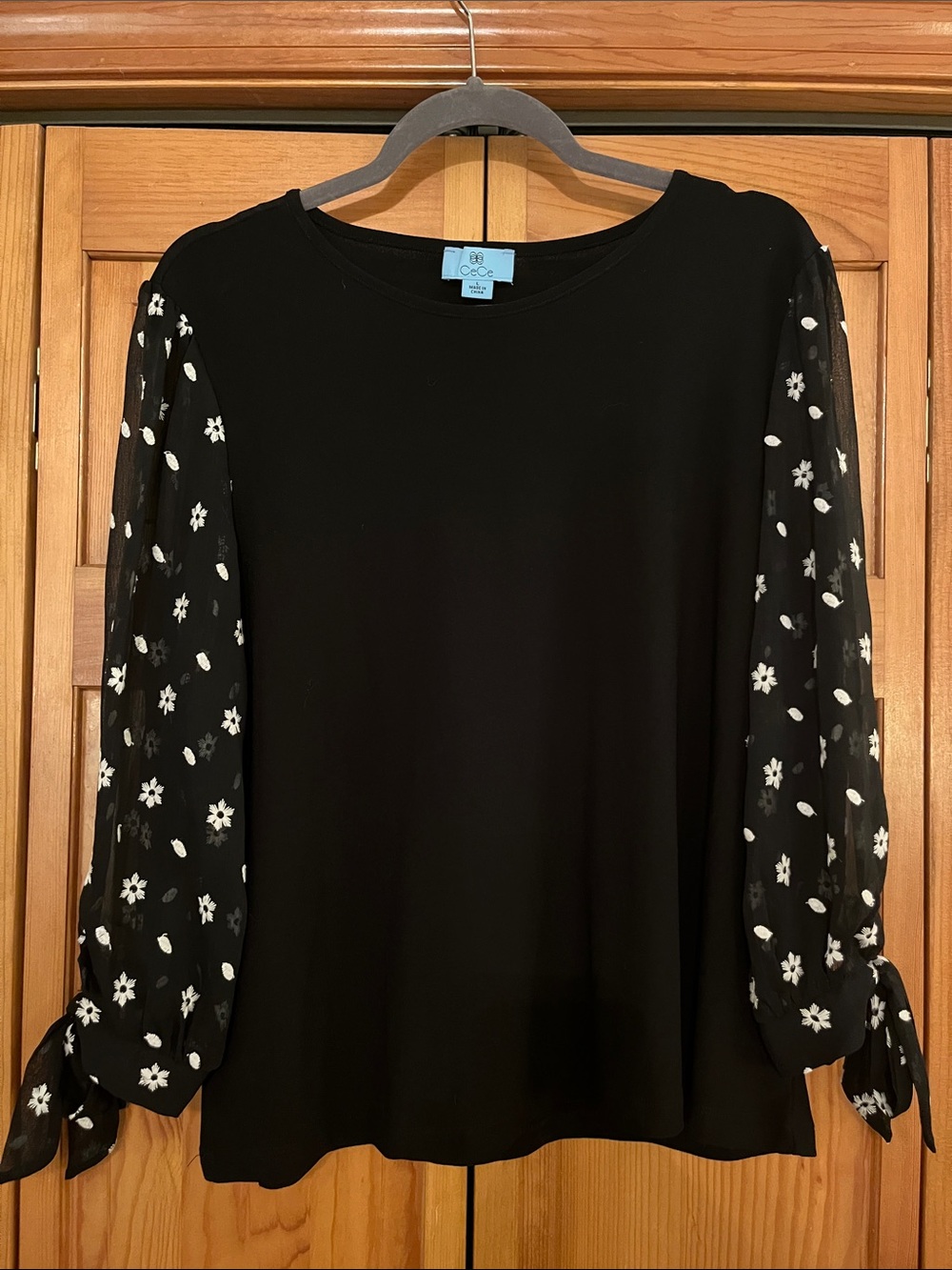 CeCe Black Top with Sheer Floral Tie-Sleeves